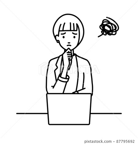 A woman in a jacket sitting at a desk and opening her PC A woman in a jacket sitting at a desk and opening her PC 87795692