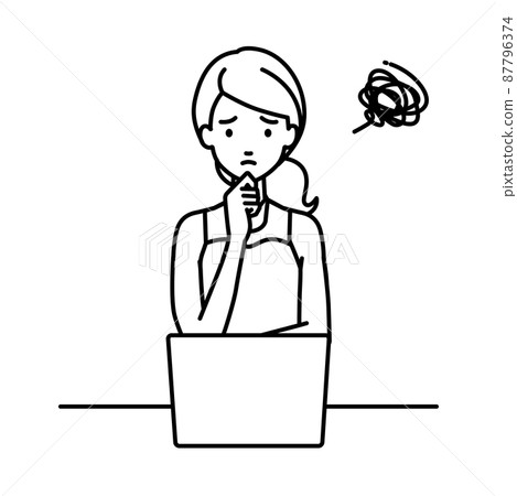 A woman in a dress sitting at a desk and opening her PC A woman in a dress sitting at a desk and opening her PC 87796374