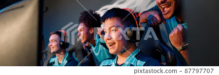 Young Asian man gaming with his friends in cyber club 87797707