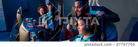 Professional esports players playing online games in internet cafe 87797708