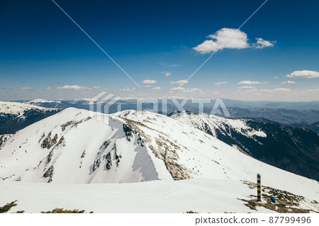 Snow in the mountains and blue sky, spring Snow in the mountains and blue sky, spring 87799496