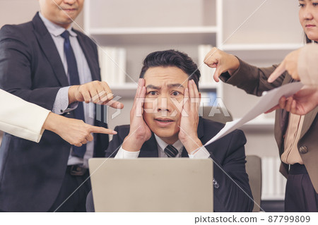 employee An enraged executive pointing out his office boos, It is your fault if you make a business mistake and are punished for it. employee An enraged executive pointing out his office boos, It is your fault if you make a business mistake and are punished for it. 87799809