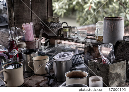 local cafe -decorated with vintage wooden furniture and antique goods, Making a traditional Thai Coffee and Tea on counter for sale at street food market, vintage style local cafe -decorated with vintage wooden furniture and antique goods, Making a traditional Thai Coffee and Tea on counter for sale at street food market, vintage style 87800193