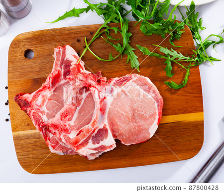 Fresh uncooked loin pork chops Fresh uncooked loin pork chops 87800428
