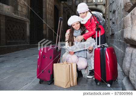 adult female and daughter with map adult female and daughter with map 87800966