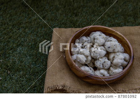 Thai Shortbread Cookies (Thai Dessert), Kanom Kleeb Lum Duen on burlap fabric background. 87801092
