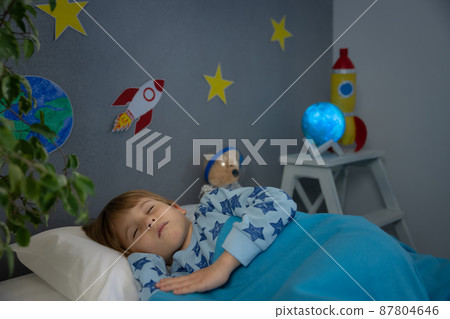 Happy child sleeping at home Happy child sleeping at home 87804646