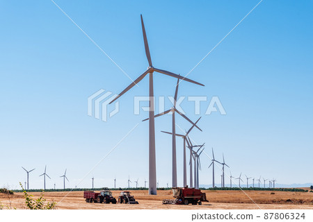 Wind turbines generating electricity on landscape of farmland Wind turbines generating electricity on landscape of farmland 87806324