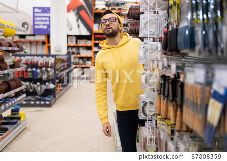 the customer cannot find the rack with the right product in the power tool and household goods store the customer cannot find the rack with the right product in the power tool and household goods store 87808359