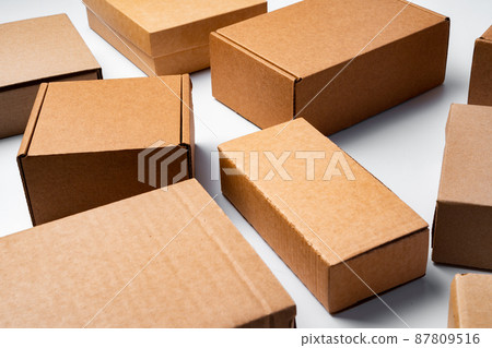 Lot of cardboard boxes on white background Lot of cardboard boxes on white background 87809516