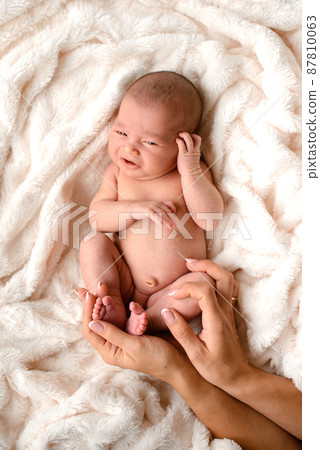 Close-up beautiful sleeping baby girl. Newborn baby girl, asleep Close-up beautiful sleeping baby girl. Newborn baby girl, asleep 87810063