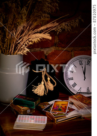 Blurred predictions background. Tarot cards layout on witch table. 87810975