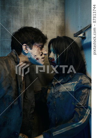 Portrait of zombie couple sniffing each other 87813744