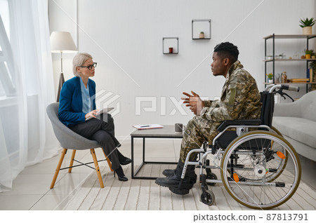 Soldier with disability at professional psychological consultation 87813791