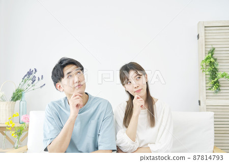 Thinking couple living Thinking couple living 87814793