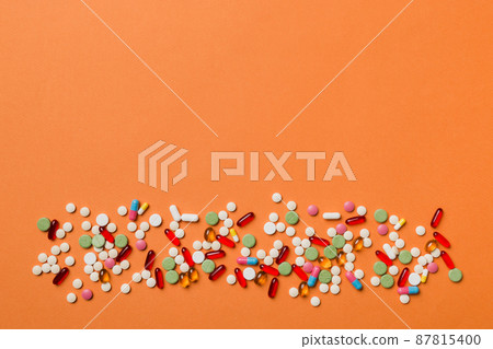 Protective face masks or surgical masks, medicine pills and thermometer on table background. Coronavirus disease. Corona virus concept. Space for text 87815400