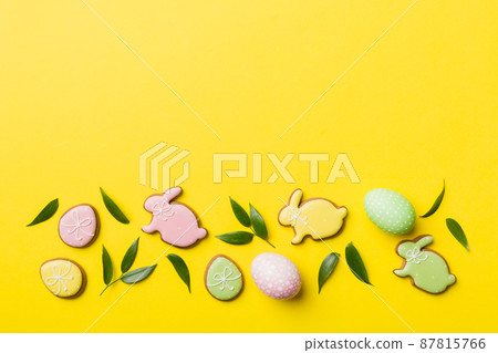 holiday preparation Multi colors Easter eggs with cookies on colored background . Pastel color Easter eggs. holiday concept with copy space holiday preparation Multi colors Easter eggs with cookies on colored background . Pastel color Easter eggs. holiday concept with copy space 87815766
