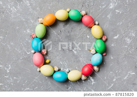 round frame Multi colors Easter eggs on colored background . Pastel color Easter eggs holiday concept with empty space for you design round frame Multi colors Easter eggs on colored background . Pastel color Easter eggs holiday concept with empty space for you design 87815820