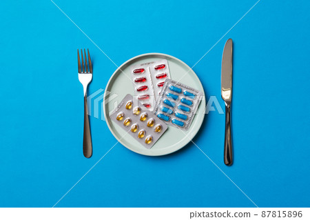 Many different weight loss pills and supplements as food on round plate. Pills served as a healthy meal. Drugs, pharmacy, medicine or medical healthycare concept Many different weight loss pills and supplements as food on round plate. Pills served as a healthy meal. Drugs, pharmacy, medicine or medical healthycare concept 87815896