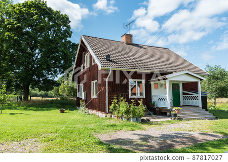 Ulva, Uppland - Sweden - Typical red wooden Swedish summer countryhouse and garden 87817027