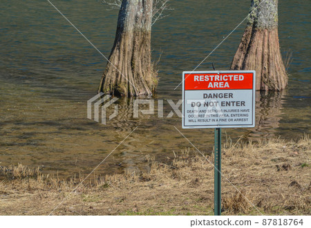 Restricted Area, Danger Do Not Enter Sign. At Broken Bow Lake in Beavers Bend State Park, Broken Bow, Oklahoma 87818764