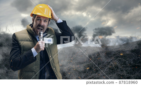 Man, news agent, journalist in protective helmet having online stream from place, giving news isolated over smoky field background 87818960
