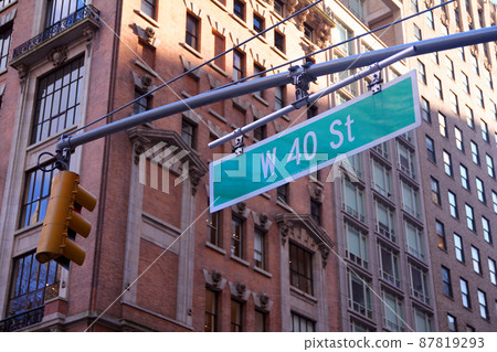 Green big West 40th Street sign hanging on a arch pole in the streets of midtown Manhattan Green big West 40th Street sign hanging on a arch pole in the streets of midtown Manhattan 87819293