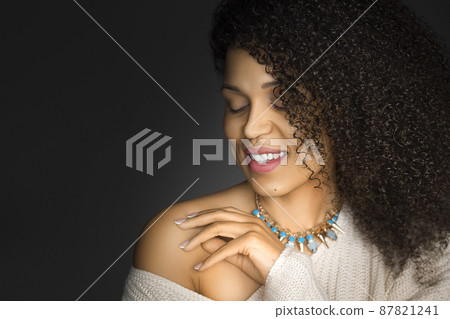 Sensual 30 years old African American woman with closed eyes. Photo on dark grey background. 87821241