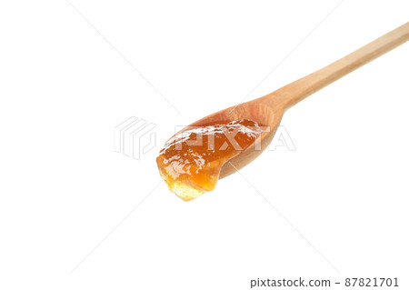Spoon with peach jam isolated on white 87821701