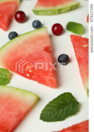 Flat lay with watermelon slices and berries on white background Flat lay with watermelon slices and berries on white background 87822109
