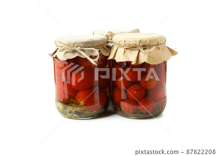 Jars of pickled tomatoes isolated on white background Jars of pickled tomatoes isolated on white background 87822208