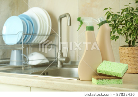 Concept of Dishwashing detergent accessories on kitchen background 87822436