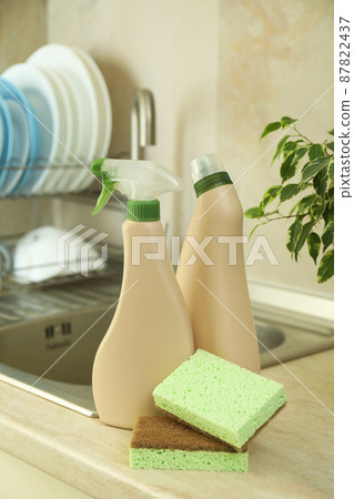 Concept of Dishwashing detergent accessories on kitchen background 87822437