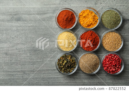 Set of different spices in glass bowls 87822552
