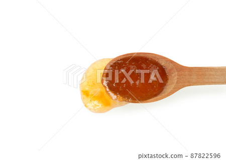 Spoon with peach jam isolated on white Spoon with peach jam isolated on white 87822596