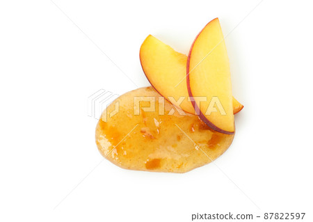 Tasty peach jam isolated on white background 87822597