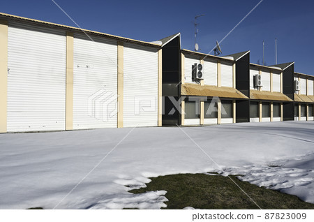 abandoned non residential building in winter, deadpan photography 87823009