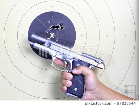 Gun and shooting target With Bullet Holes. 92fs or m9 pistol open slide. Classic Paper Shooting Target. Holes In Target. For Sport, Hunters, Military, Police. Gun and shooting target With Bullet Holes. 92fs or m9 pistol open slide. Classic Paper Shooting Target. Holes In Target. For Sport, Hunters, Military, Police. 87823544