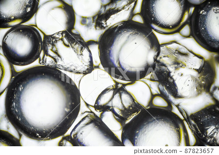 Silica gel for moisture control, absorbent particles under a light microscope, magnification 40 times 87823657