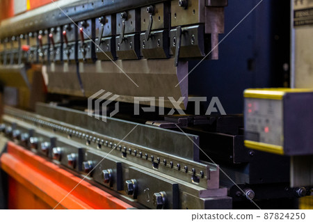 closeup view of industrial sheet bending press brake with tool 87824250