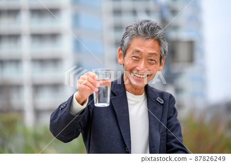 Senior male hydration, looking at the camera, casual 87826249