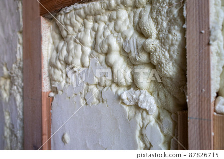Construction site of a newly built single-family house with spray insulation Construction site of a newly built single-family house with spray insulation 87826715