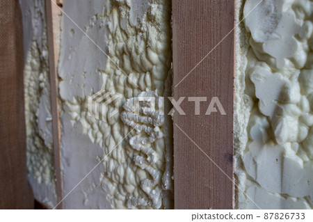 Construction site of a newly built single-family house with spray insulation Construction site of a newly built single-family house with spray insulation 87826733