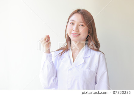 White coat woman in guts pose 1 87830285