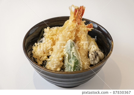 Bowl of rice and fried fish 87830367