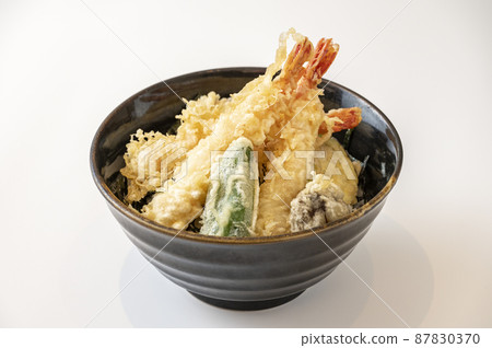 Bowl of rice and fried fish 87830370