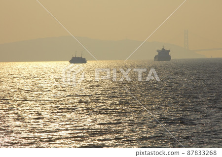 Cruise liner "Concerto" sailing in the golden strait of Akashi / Awaji Island in the distant view Cruise liner "Concerto" sailing in the golden strait of Akashi / Awaji Island in the distant view 87833268