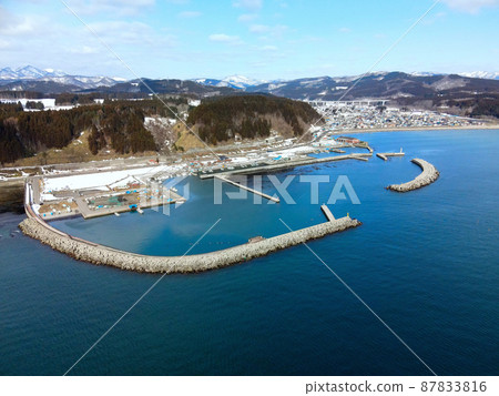 Aerial view of Moheji fishing port in Hokuto City, Hokkaido in early spring 87833816