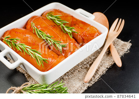 Fresh chicken.Convenience food,precooked.Raw marinated chicken.Marinated chicken fillet with spices.Cooking chicken with spices in the oven. 87834641