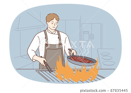 Male chef cook meat on fire in restaurant  87835445
